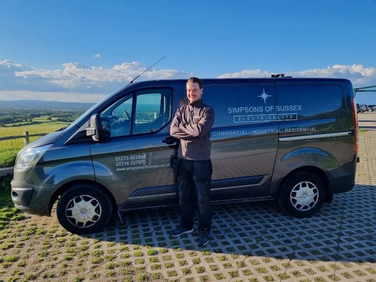 Daniel Simpson with the Simpsons of Sussex van