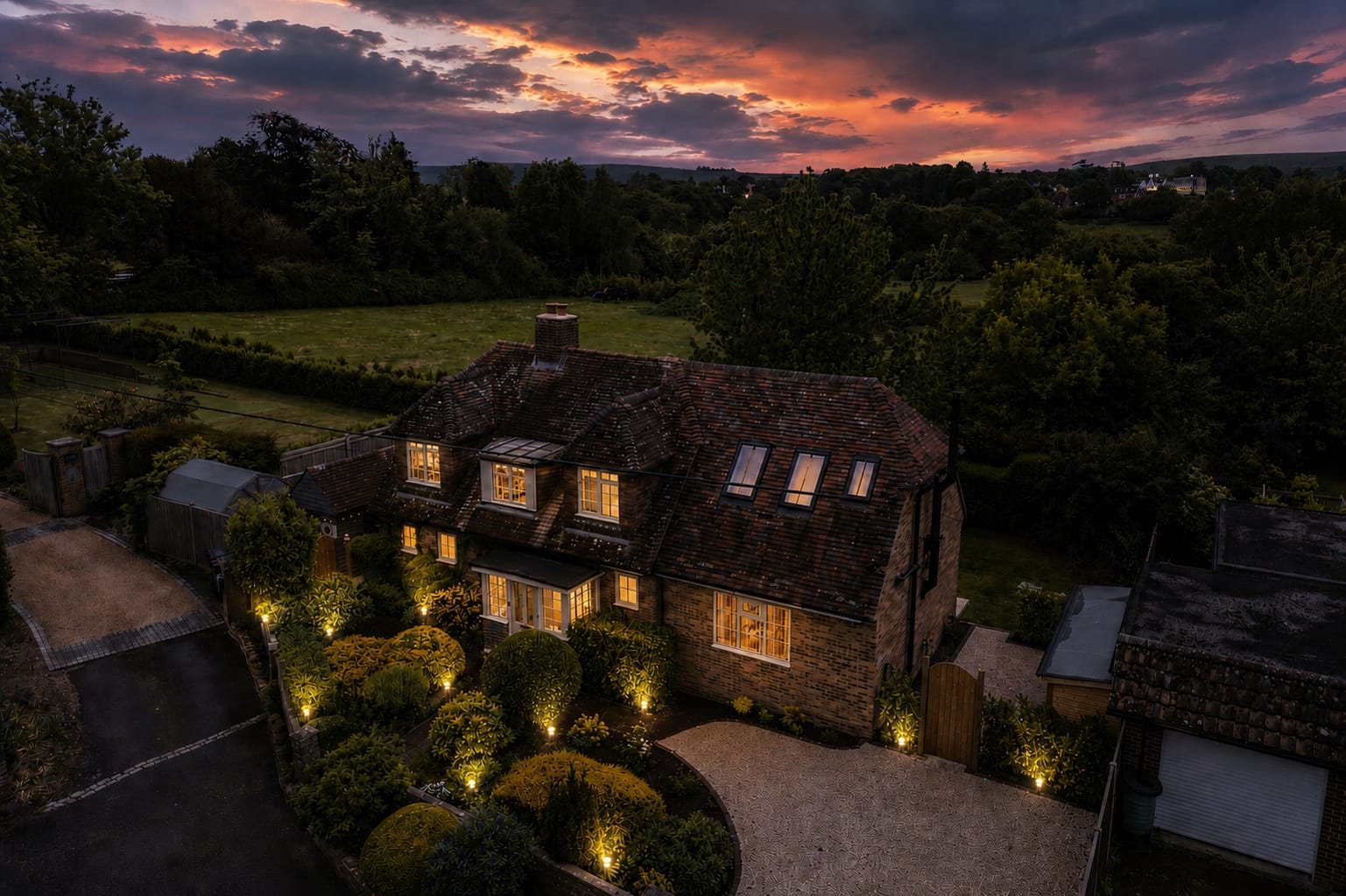 Country residence with exterior lighting at dusk